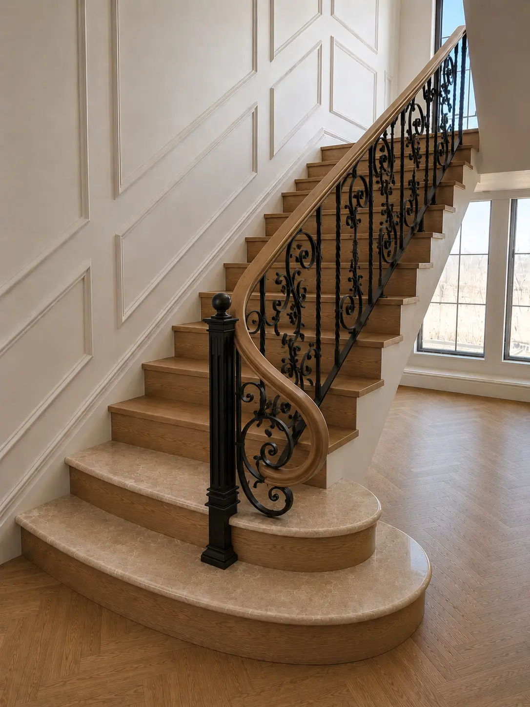 A finished curved staircase — oak treads with one-piece nosing and wrought-iron scroll railing, meeting a herringbone oak floor